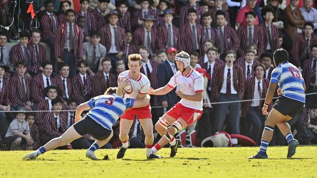 Nudgee prop Harry Vella tackles IGS winger Mitchell Harsant