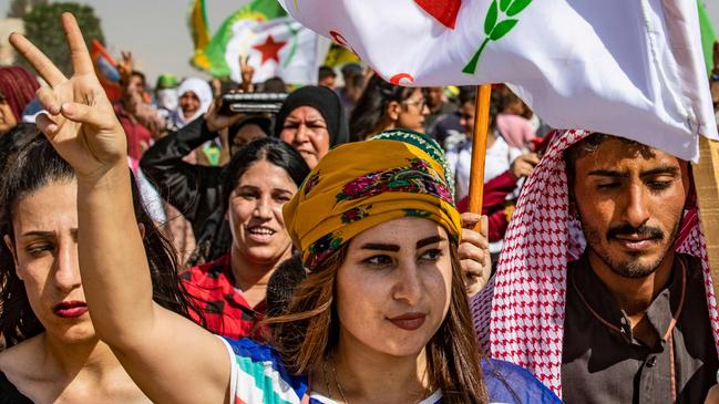 Syrian Kurds take part in a demonstration against Turkish threats at Ras al-Ain in Hasakeh province near the Turkish border on Monday. Picture: AFP