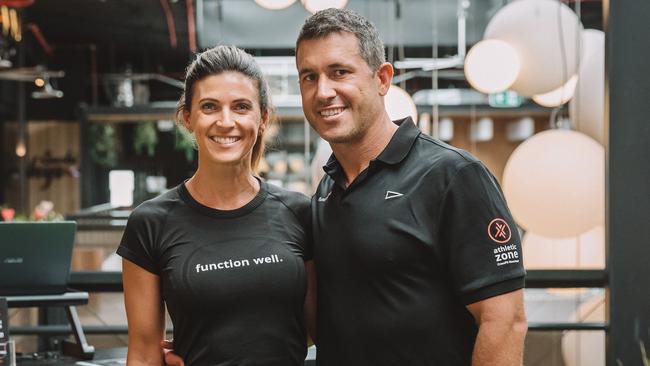 Darren Bain and partner Tash at their gym before the floods