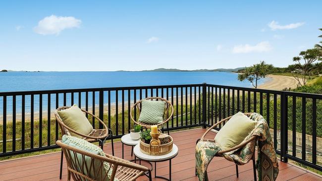 Beachfront home sells for shy of $1m, next door still up for grabs