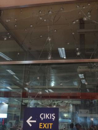 More bullet holes and cracked glass look like a spider web. Picture: Charles Miranda