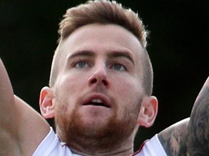 Jeremy Howe of the Demons flies for a mark during the Melbourne Football Clubs training session at Gosch's Paddock, Melbourne on Friday 27th March, 2015. Picture: Mark Dadswell