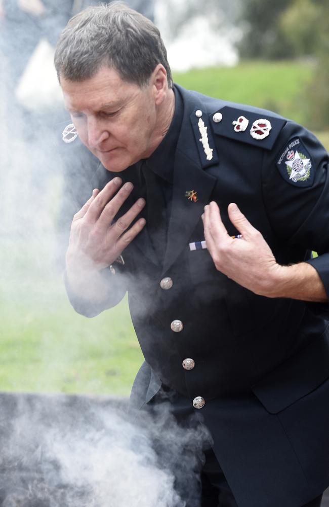 Shane Patton participates in a smoking ceremony at the Aboriginal Advancement League at Thornbury. Picture: Andrew Henshaw