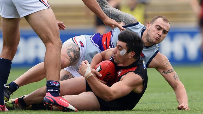 Southern Football League v Essendon and District Football League at Princess Park Carlton. Essendon player Dylon Joyce is tackled. Picture: Andy Brownbill