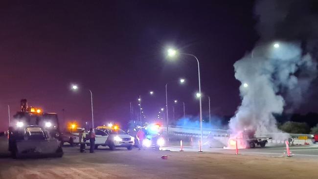 Fireys extinguish burning ute on Townsville Ring Road. Picture: Tidy Towing