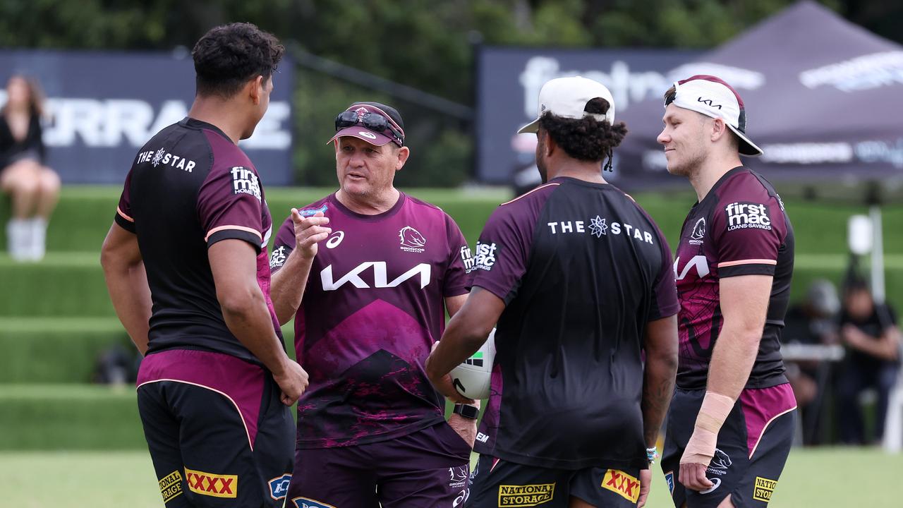 Coach Kevin Walters talking with Selwyn Cobbo, Ezra Mam, and Billy Walters. Picture: Liam Kidston