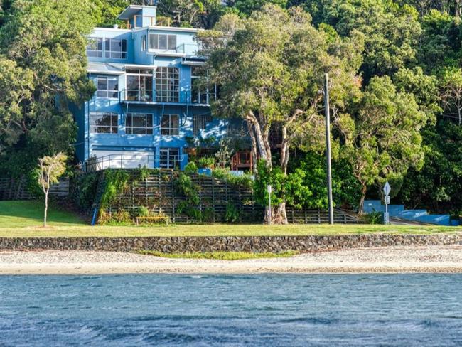 This impressive multi-level home at Shaws Bay will go up for auction.