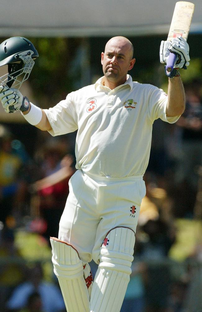 Darren Lehmann raises his bat for his hundred at TIO Stadium.