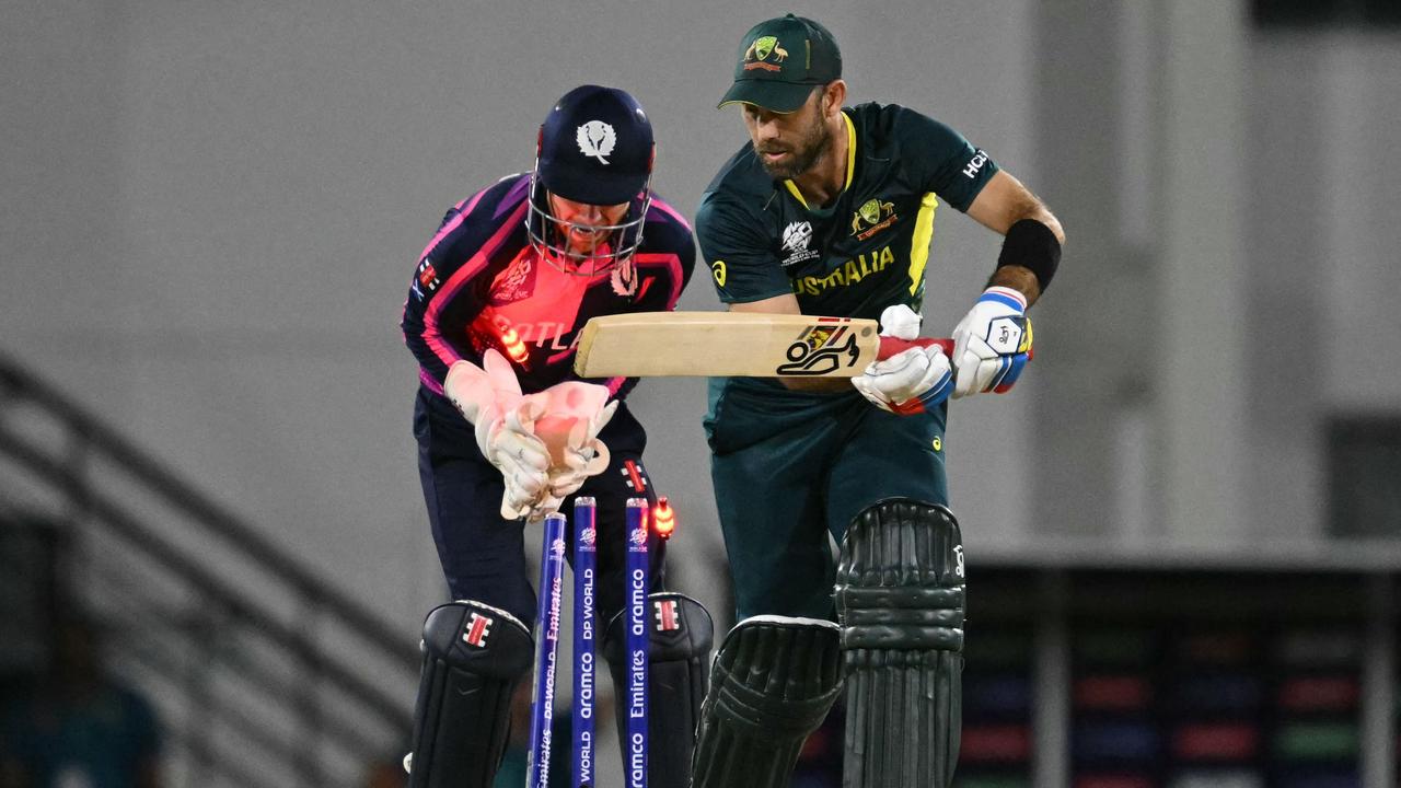 Australia's Glenn Maxwell is bowled cheaply by Scotland spinner Mark Watt. Photo by TIMOTHY A. CLARY / AFP