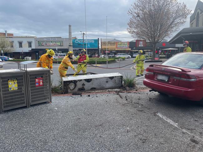 The red Subaru is removed from the concrete pillar near the pedestrian crossing. Picture: Jack Colantuono