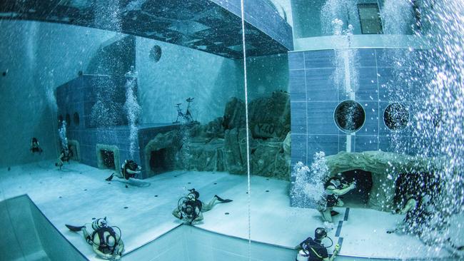 Divers check out the Y-40, the deepest swimming pool in the world. Picture: Piero Mescalchiny/Y-40/Caters News