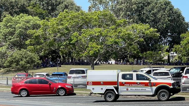 Students at Fitzgerald State School, North Mackay, were evacuated to the oval after smoke was reported coming out of a classroom around 12.50pm on October 21, 2024. Picture: Fergus Gregg