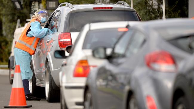 People queue for testing outside The Crossroads Hotel in Casula, where a COVID cluster continues to grow. Picture: NCA NewsWire / Jeremy Piper