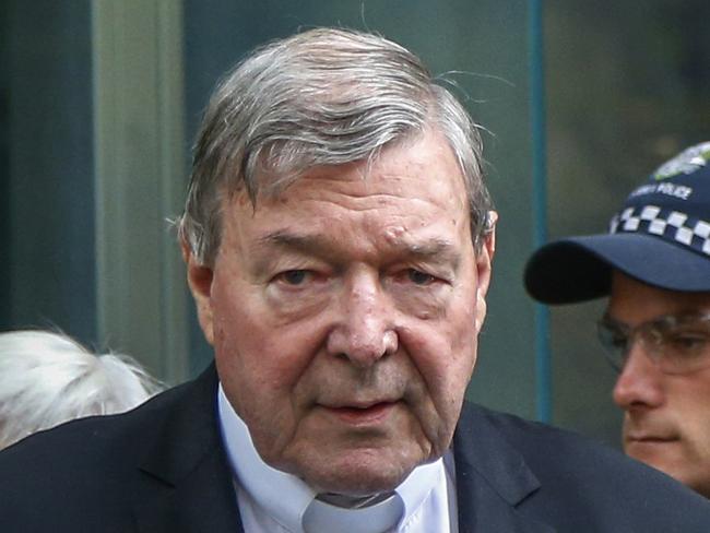 FILE - In this May 2, 2018, file photo, Cardinal George Pell, the most senior Catholic cleric to face sex charges, leaves court in Melbourne, Australia. Pell was sentenced in an Australian court on Wednesday, March 13, 2019 to 6 years in prison for molesting two choirboys in a Melbourne cathedral more than 20 years ago.  (AP Photo/Asanka Brendon Ratnayake, File)