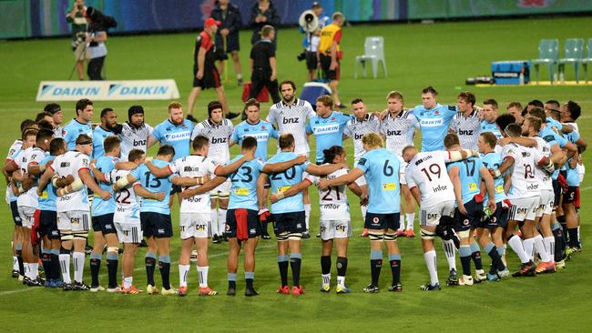 Waratahs and Crusaders players unite before the match to remember Christchurch terror attacks. Picture: AAP