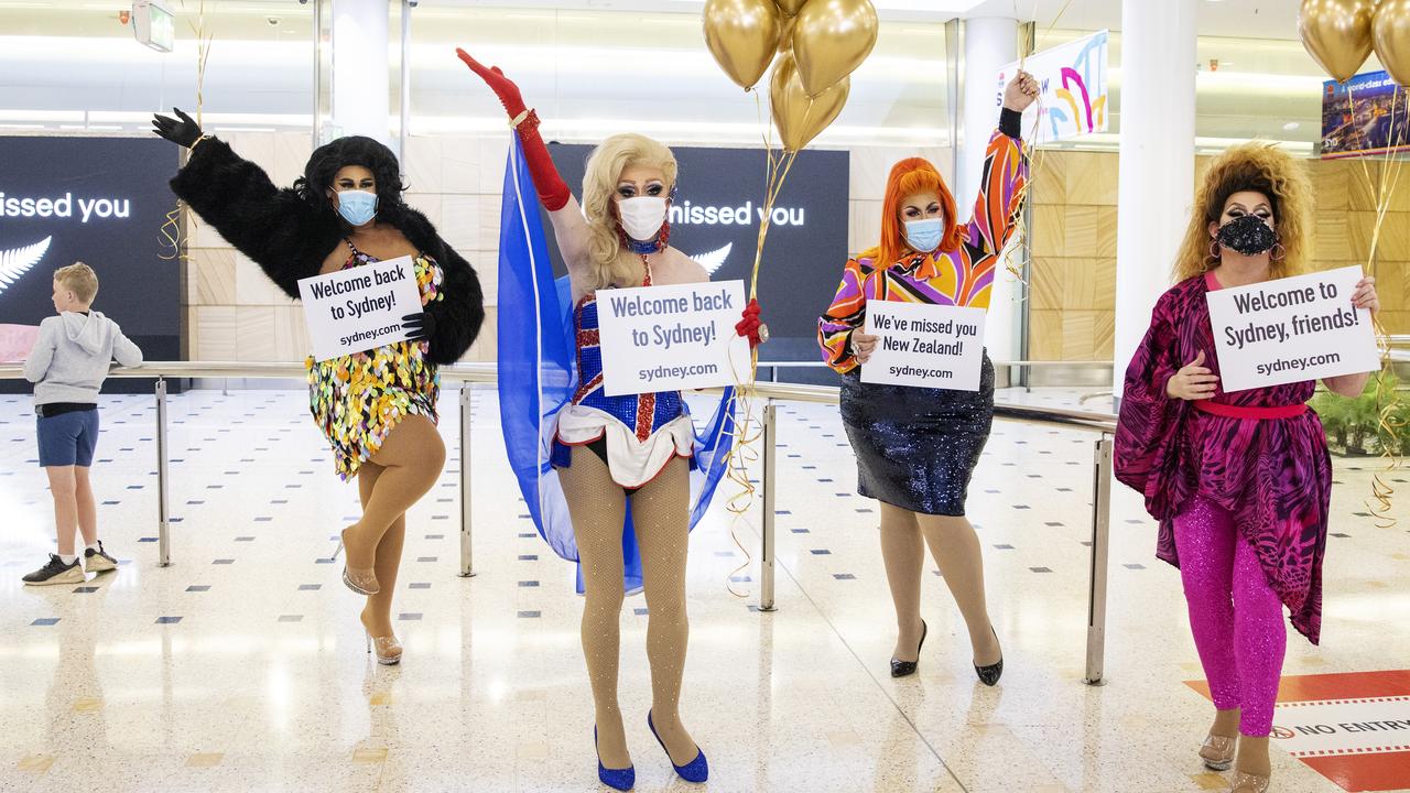 Members of the “welcome back drag committee” greet travellers arriving from New Zealand at Sydney International Airport. Picture: Getty Images