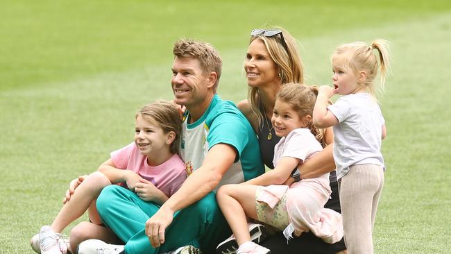 David Warner and wife Candice Warner pose for a photo with their daughters Ivy Mae (L), Indi Rae (2L) and Isla Rose (R) during an Australian Ashes squad nets session at Melbourne Cricket Ground. (Photo by Mike Owen/Getty Images)