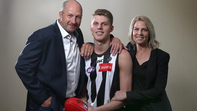 Collingwood draftee Will Kelly with his father, Magpies premiership player Craig Kelly and mother Meredith. Picture: Michael Klein