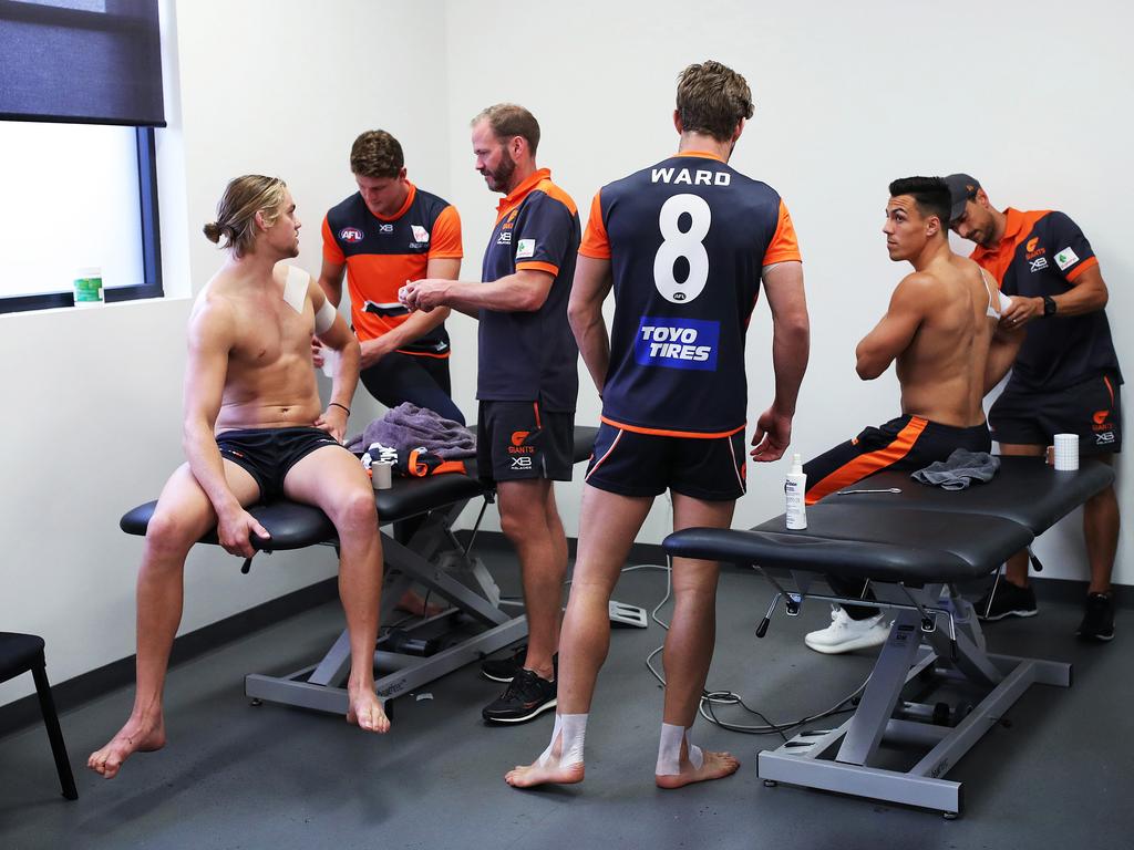 Harrison Himmelberg, Callan Ward and Dylan Shiel get strapped. Picture: Phil Hillyard