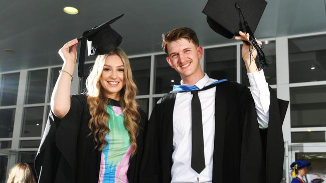 Pharmacy graduate Eren White and Medicine graduate Patrick de Waele at the James Cook University graduation at Townsville Entertainment Centre. Picture: Shae Beplate.