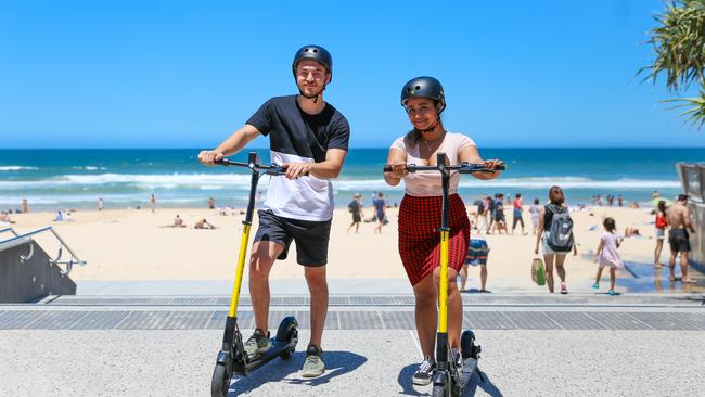 Tourists Alexander Culic and Nusrat Shupritt take a ride on some e-scooters. Photo: Supplied.