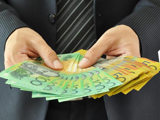 Businessman hands holding money  - Australian dollar bills. equity crowdfunding - australian money for business ideas