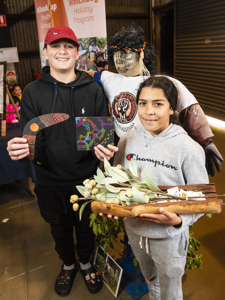 Jett Silcox and Mayalii Gordon with a figure of the warrior Multuggerah at the Toowoomba NAIDOC Week celebrations at The Goods Shed, Monday, July 4, 2022. Picture: Kevin Farmer