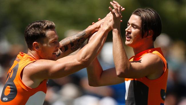 Daniel Lloyd and Lachie Tiziani celebrate a goal against West Coast.