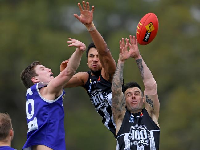 Jayden Eales, Khyle Forde and Lachlan Herring fly for the ball. Picture: Andy Brownbill