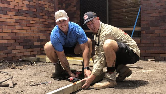 Jarrod Wallace (left) on the site with Red Dog Landscaping. Picture: Gold Coast Titans