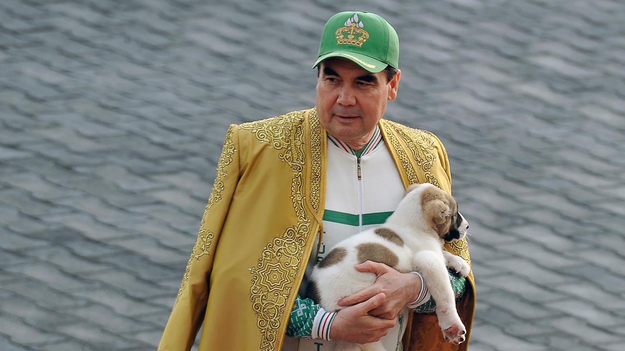 Turkmenistan's President Gurbanguly Berdymukhamedov holds a Turkmen shepherd dog, locally known as Alabai, as he takes part in celebrations for the Day of the Horse in Ashgabat on April 28, 2018. (Photo by Igor SASIN / AFP)