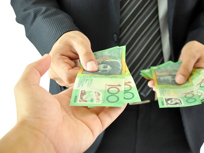 Businessman hand giving money  - Australian dollars