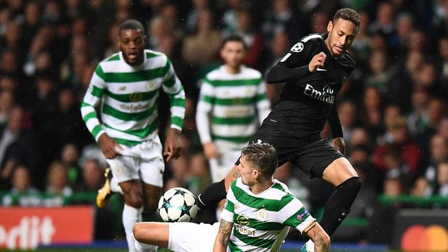 Celtic's Swedish defender Mikael Lustig tackles Paris Saint-Germain's Brazilian striker Neymar