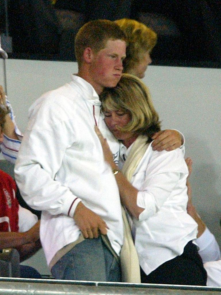 A 19-year-old Prince Harry watches England play in the 2003 World Cup final with the wife of England coach Clive Woodward, Jane. Picture: AFP PHOTO / Odd ANDERSEN