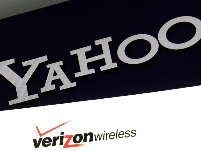 FILE - This Monday, July 25, 2016, file photo shows the Yahoo and Verizon logos on a laptop, in North Andover, Mass. Yahoo shares are sliding on worries that Verizon will walk away or cut the price on its $4.8 billion deal for the internet companyâ€™s digital operations. On Wednesday, Dec. 14, 2016, Yahoo revealed a massive hack of more than 1 billion user accounts after announcing a separate breach of 500 million accounts in September. (AP Photo/Elise Amendola, File)