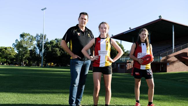 Goodwood Saints president Craig Scott with players Eve Mackenzie and Grace Bridge before the club’s grandstand and clubrooms were demolished. Picture: AAP/Morgan Sette