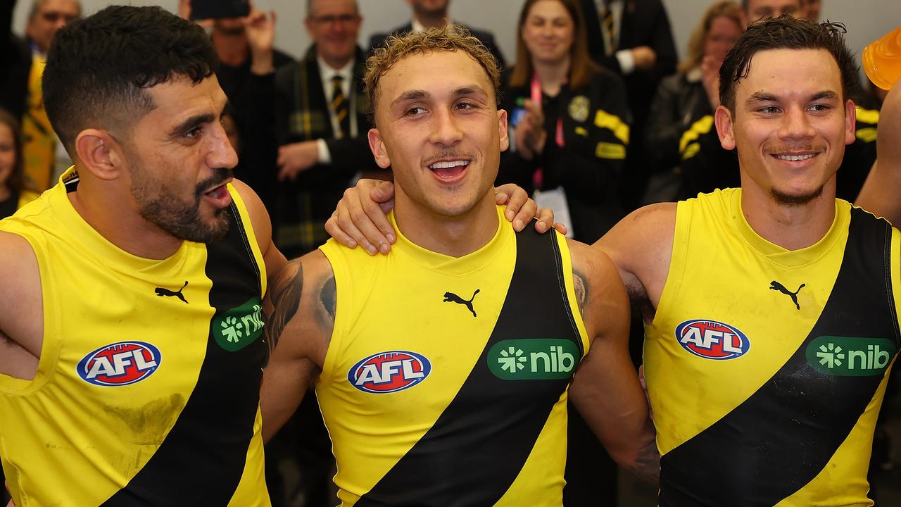 PERTH, AUSTRALIA - JUNE 10: Marlion Pickett, Shai Bolton and Daniel Rioli of the Tigers sing their club song after winning the round 13 AFL match between Fremantle Dockers and Richmond Tigers at Optus Stadium, on June 10, 2023, in Perth, Australia. (Photo by Paul Kane/Getty Images)