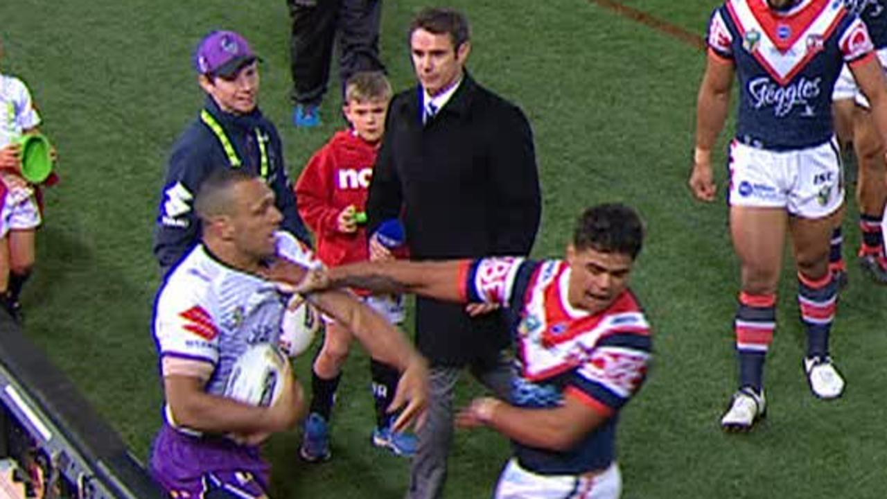 Brad Fittler looks on as Latrell Mitchell and Will Chambers square up.