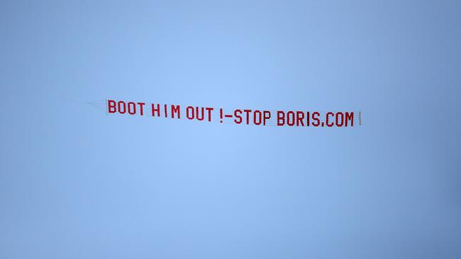 A plane with a message for Boris Johnson flies over Elland Road in Leeds on Saturday during the Premier League match between Leeds United and Newcastle United. Picture: Getty Images