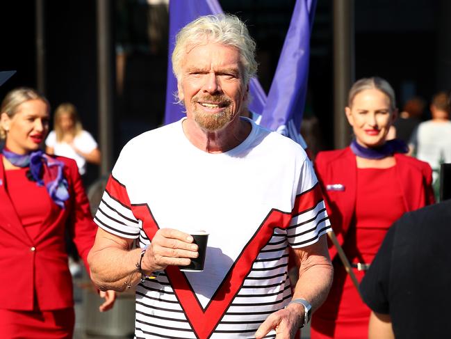 Sir Richard Branson greets commuters in Australia to announce Virgin Voyages and Virgin Australia will offer flight and cruise packages for Aussies wanting to cruise the Caribbean. Picture: Toby Zerna