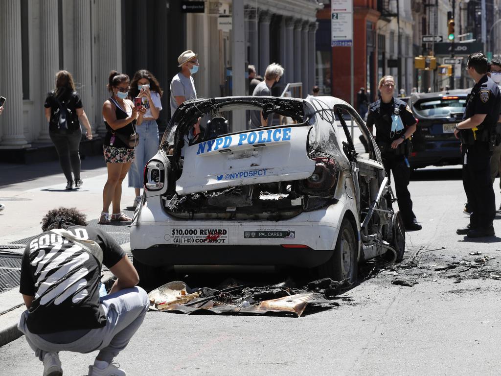 A burned-out and abandoned New York City Police vehicle. Picture: Kathy Willens