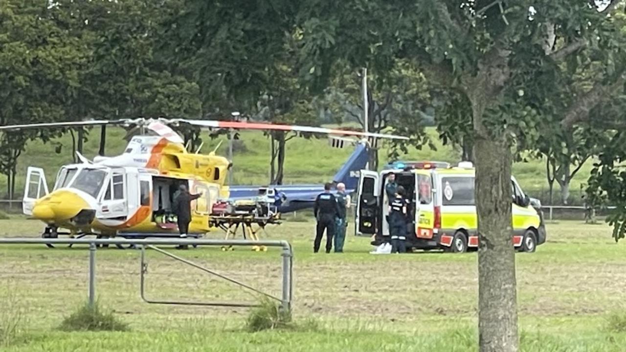 Multiple emergency crews are at the Sarina showgrounds, trying to save a man in his 20s who was seriously injured in a nearby Bruce Hwy crash.