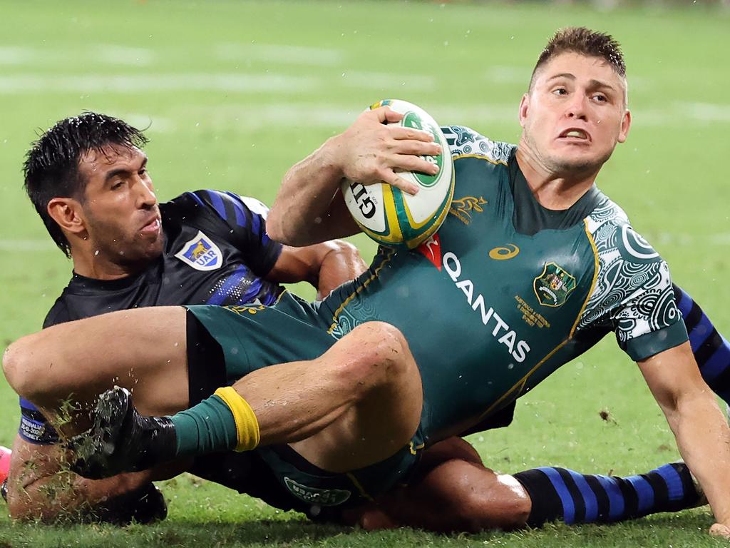 Australia's James O'Connor is tackled by Argentina's Matias Orlando.