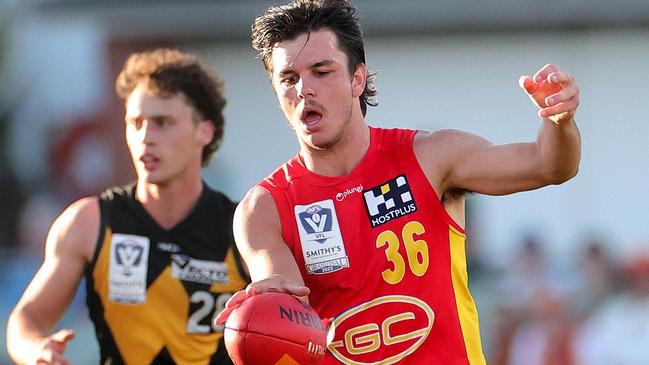 Elijah Hollands of the Suns kicks the ball during the VFL grand final. (Photo by Kelly Defina/AFL Photos/via Getty Images)