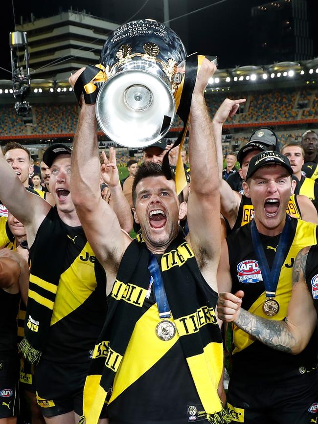 Trent Cotchin of the Tigers celebrates with the premiership cup during the 2020 Toyota AFL Grand Final match between the Richmond Tigers and the Geelong Cats at The Gabba. (Photo by Michael Willson/AFL Photos via Getty Images)