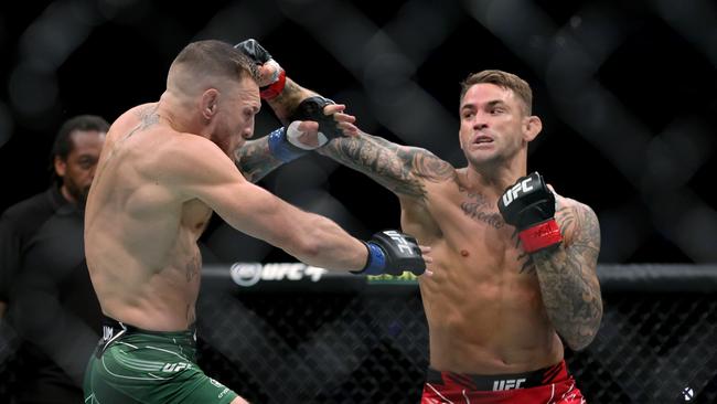 Dustin Poirier lands on Conor McGregor in the first round at UFC 264. Picture: Stacy Revere/Getty/AFP