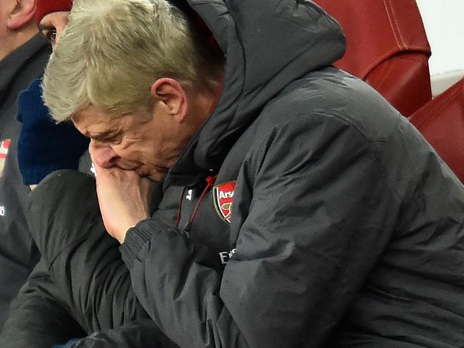 Arsenal's French manager Arsene Wenger reacts in his seat during the English Premier League football match between Arsenal and Manchester City at the Emirates Stadium in London on March 1, 2018.  / AFP PHOTO / Glyn KIRK / RESTRICTED TO EDITORIAL USE. No use with unauthorized audio, video, data, fixture lists, club/league logos or 'live' services. Online in-match use limited to 75 images, no video emulation. No use in betting, games or single club/league/player publications.  /