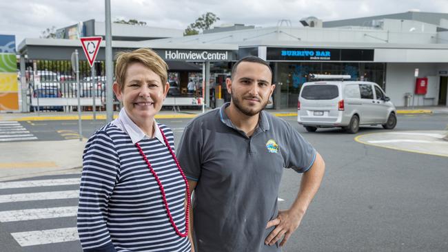 Janelle MacGinley from McDonald’s Holmview (left) and Walid Fayad from 7 Seas Takeaway are happy the centre won’t be extended until 2021. (AAP Image/Richard Walker)