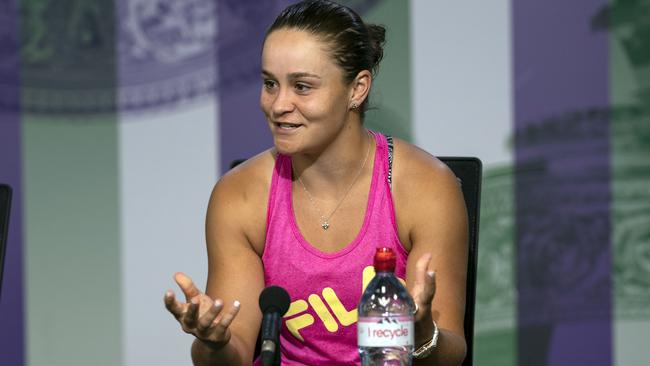 Australia's Ashleigh Barty smiles as she talks to the media during a press conference after losing her Women's singles match against United States' Alison Riske during day seven of the Wimbledon Tennis Championships in London, Monday, July 8, 2019. (Adam Warner, AELTC via AP)