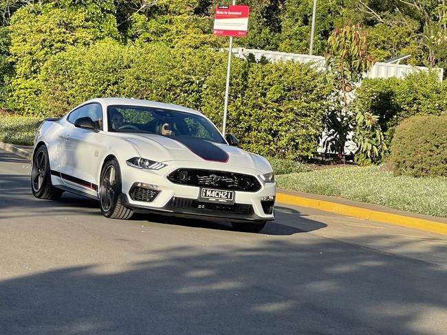 A 2021 Mach 1 Mustang arrives at the formal.